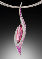 Elegante pendant, 5.88 carat vivid pink tourmaline with diamonds and pink sapphires set in 14 karat white gold. ADAM NEELEY