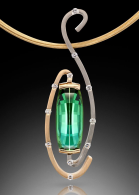 Exquisite pendant, 8.54 carat green tourmaline cut by Stephen Avery with 0.39 carat total weight of diamonds in 14kt yellow and white gold. ADAM NEELEY