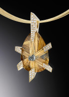 Golden Star pendant, features rutilated quartz and .52 cttw of diamonds set in 14 karat yellow gold. ADAM NELEY
