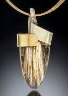 Sunshine pendant, rutilated quartz with Spectra gold and 10-strand 16″ chain in 14 kt gold. ADAM NEELEY